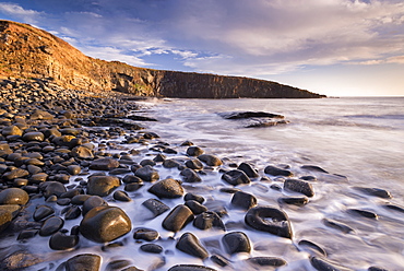 Waves lap against the seashore at Cullernose Point near Howick, Northumberland, England, United Kingdom, Europe