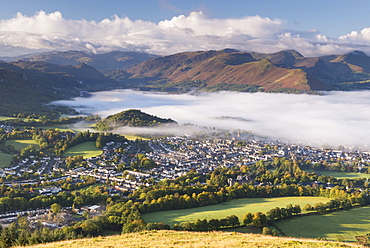 Keswick and mist covered Derwent Water at dawn, Lake District National Park, Cumbria, England, United Kingdom, Europe