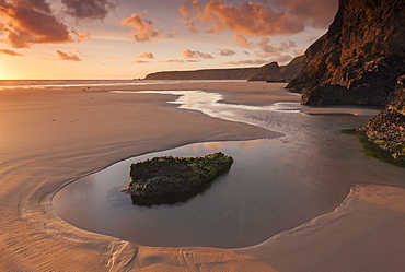 Tidal pools on Bedruthan Steps beach at sunset, Cornwall, England, United Kingdom, Europe