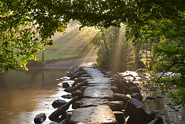 Tarr Steps, an ancient clapper bridge spanning the River Barle, Exmoor National Park, Somerset, England, United Kingdom, Europe