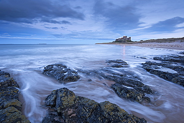 Stormy evening in winter on the beach near Bamburgh Castle, Northumberland, England, United Kingdom, Europe