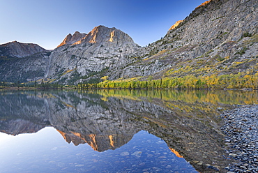 Carson Peak reflected in Silver Lake at dawn, June Lake Loop, California, United States of America, North America