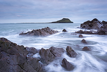 Rocky coast of the Gower looking towards Worm's Head in winter, South Wales, Wales, United Kingdom, Europe