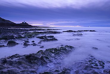 Mumbles lighthouse at dawn in winter from Bracelet Bay, Swansea, Wales, United Kingdom, Europe