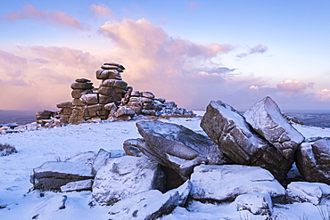 Sunrise above covered rocks at Great Staple Tor in winter, Dartmoor Nastional Park, Devon, England, United Kingdom, Europe