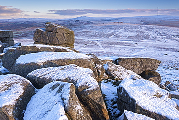 Snow covered granite outcrop in winter at Sharpitor in Dartmoor National Park, Devon, England, United Kingdom, Europe