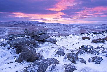 Beautiful winter sunrise over a frozen and snow covered Belstone Tor, Dartmoor National Park, Devon, England, United Kingdom, Europe