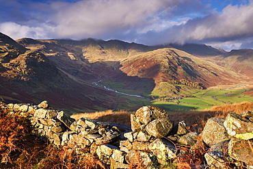 Tumbledown dry stone wall near Great Langdale in autumn in the Lake District National Park, Cumbria, England, United Kingdom, Europe