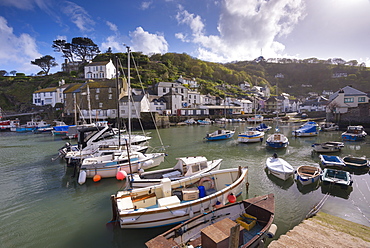 Fishing boats moored in picturesque Polperro harbour on a sunny spring evening, Cornwall, England, United Kingdom, Europe