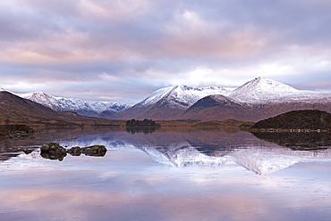 Frozen Lochan na h-Achlaise and snow covered Black Mount mountain range, Rannoch Moor, Scotland, United Kingdom, Europe