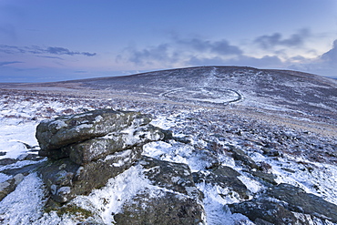 Snow dusted Bronze Age settlement of Grimspound from Hookney Tor, Dartmoor, Devon, England, United Kingdom, Europe