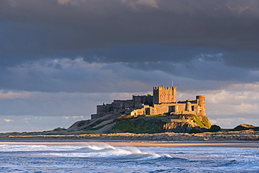 Evening sunlight on Bamburgh Castle, Northumberland, England, United Kingdom, Europe