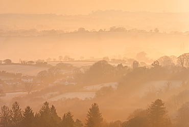 Misty and frosty winter sunrise over Dartmoor countryside near Throwleigh, Devon, England, United Kingdom, Europe