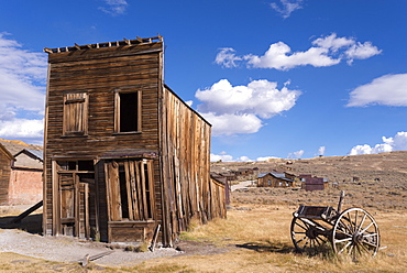 Abandoned wooden house and wagon in Bodie Ghost Town, California, United States of America, North America