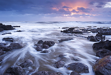 Sunset over the rocky shores of Porthcawl in South Wales, Wales, United Kingdom, Europe