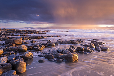 Stormy clouds in winter over the Bristol Channel at sunset, Nash Point, Glamorgan, Wales, United Kingdom, Europe