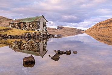 Stone boathouse on Sorvagsvatn (Leitisvatn Lake) on the island of Vagar in the Faroe Islands, Denmark, Europe