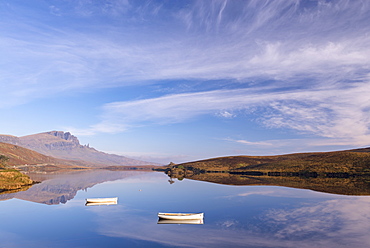 Boats on a mirror still Loch Fada, Isle of Skye, Inner Hebrides, Scotland, United Kingdom, Europe