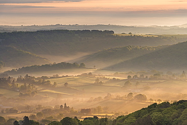 Mist covered rolling countryside at dawn, Dartmoor National Park, Devon, England, United Kingdom, Europe