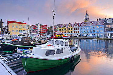 Boats moored in Torshavn harbour at sunrise, Faroe Islands, Denmark, Europe