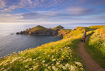 Man appreciating the beautiful coastal view at The Rumps, North Cornwall, England, United Kingdom, Europe