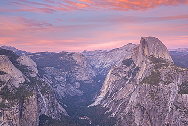 Beautiful pink sunset above Half Dome and Yosemite Valley, viewed from Glacier Point, Yosemite National Park, UNESCO World Heritage Site, California, United States of America, North America