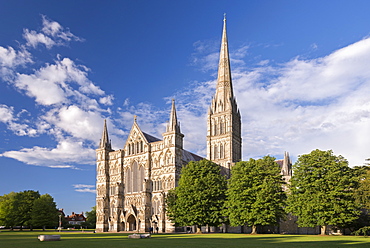 Evening sunshine glows on the ornate facade of Salisbury Cathedral, Salisbury, Wiltshire, England, United Kingdom, Europe