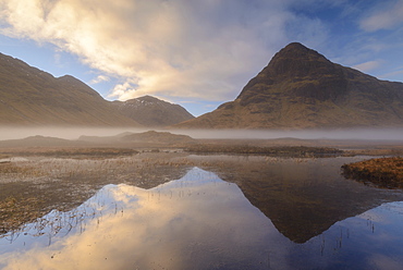 Buachaille Etive Beag reflected in Lochan na Fola at dawn, Glencoe, Scottish Highlands, Scotland, United Kingdom, Europe