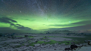 Aurora Borealis (Northern Lights) and Milky Way in the night sky above Jokulsarlon glacial lagoon, Iceland, Polar Regions