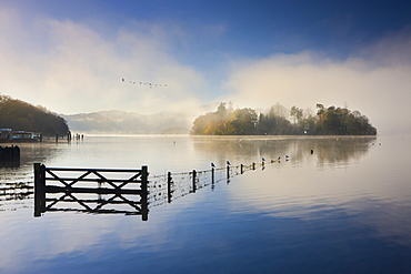 Misty morning on the shores of Derwent Water in autumn, Lake District National Park, Cumbria, England, United Kingdom, Europe