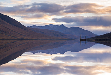 Reflections of mountains in Loch Etive at sunset, Glen Etive, Highlands, Scotland, United Kingdom, Europe