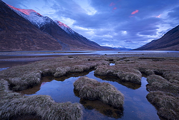 Pink crested mountains at sunset in winter in the Scottish Highlands, Loch Etive, Argyll, Scotland, United Kingdom, Europe