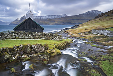 Traditional Faroese wooden turf roofed church in the village of Funningur, Eysturoy, Faroe Islands, Denmark, Europe