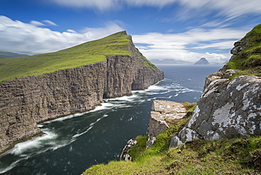 Towering sea cliffs on the island of Vagar in the Faroe Islands, Denmark, Europe