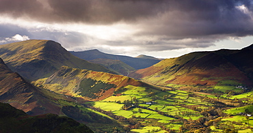 Late afternoon sunshine illuminates the lush green Newlands Valley in autumn, Lake District National Park, Cumbria, England, United Kingdom, Europe