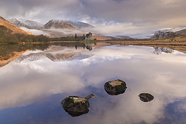 Kilchurn Castle on a reflective Loch Awe in winter, Argyll and Bute, Highlands, Scotland, United Kingdom, Europe