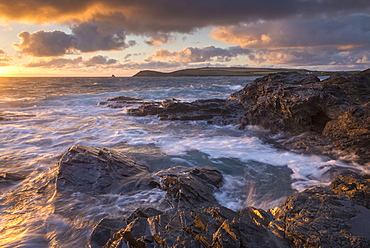 Waves crash against the rocky shores of Constantine Bay, looking towards Trevose Head, Cornwall, England, United Kingdom, Europe