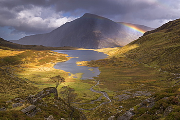 Rainbow passing over Cwm Idwal in the mountains of Snowdonia National Park, North Wales, United Kingdom, Europe