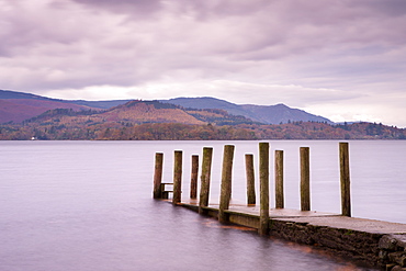 Wooden jetty on the shores of Derwent Water in autumn, Lake District National Park, Cumbria, England, United Kingdom, Europe