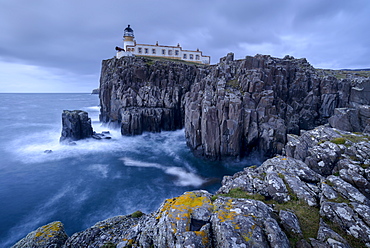 Neist Point lighthouse, perched on dramatic cliff tops on the west coast of the Isle of Skye, Inner Hebrides, Scotland, United Kingdom, Europe