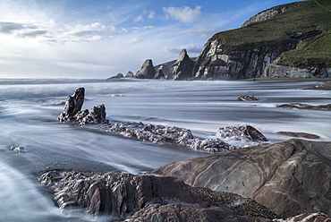 Waves rush over the beach at Westcombe Bay in the South Hams in winter, Devon, England, United Kingdom, Europe