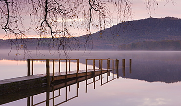 Sunrise over Derwent Water from Hawes End jetty in autumn, Lake District National Park, Cumbria, England, United Kingdom, Europe