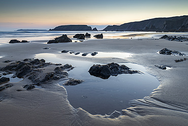 Tidal pools on Marloes Sands beach at twilight, Pembrokeshire Coast National Park, Wales, United Kingdom, Europe