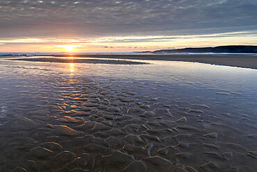 Sunset over the deserted sandy beach at Freshwater West, Pembrokeshire Coast National Park, Wales, United Kingdom, Europe