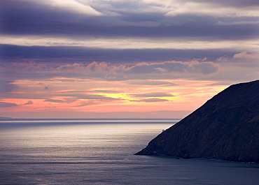 Foreland Lighthouse is barely visible near the base of the mighty cliffs of Foreland Point, Countisbury, Exmoor National Park, Devon, England, United Kingdom, Europe