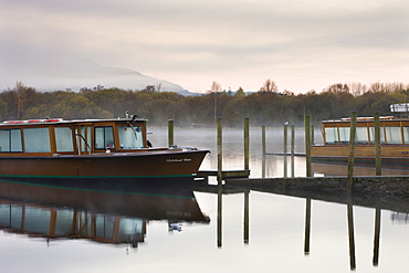 Lakeland Mist boat moored on Derwent Water on a misty autumn morning, Keswick, Lake District National Park, Cumbria, England, United Kingdom, Europe