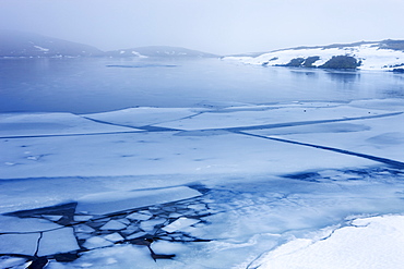 Ice and snow covering Llyn Y Fan Fawr in the Black Mountain in winter, Brecon Beacons National Park, Wales, United Kingdom, Europe