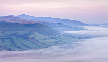 Low hanging mist shrouds the Usk Valley at dawn, viewed from the summit of Allt yr Esgair, Brecon Beacons National Park, Powys, Wales, United Kingdom, Europe