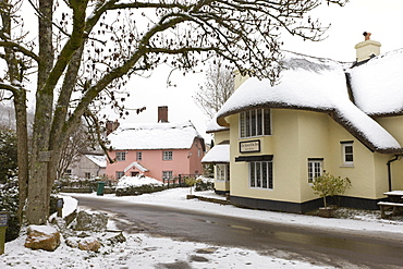 Snow covered country pub and cottages in the village of Winsford in winter, Exmoor National Park, Somerset, England, United Kingdom, Europe