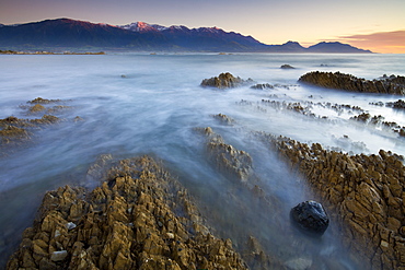 First light glows on the mountains of the Seaward Kaikoura ranges, Kaikoura, South Island, New Zealand, Pacific